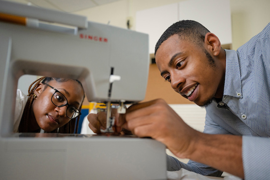 man using a sewing machine